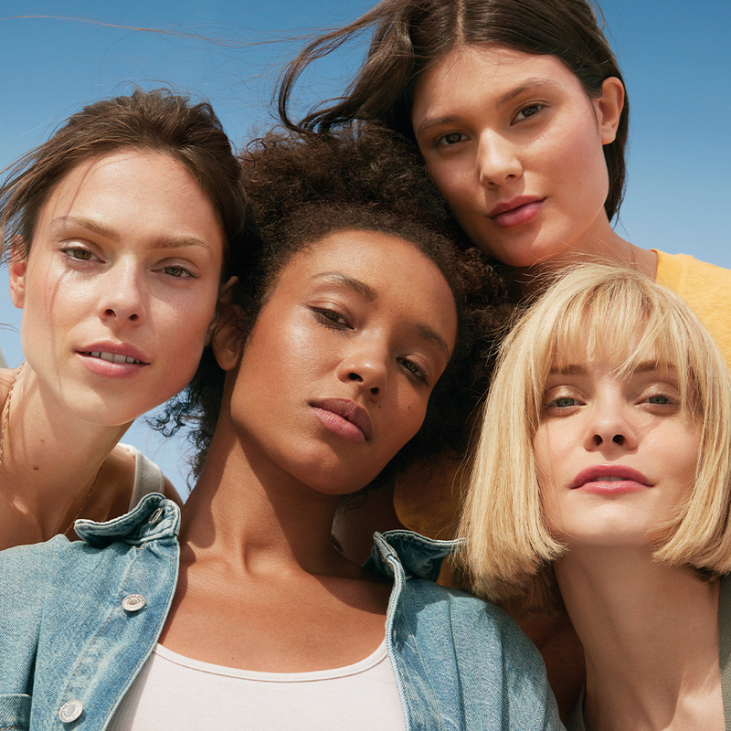 Four women in sunlight, protected by SPF